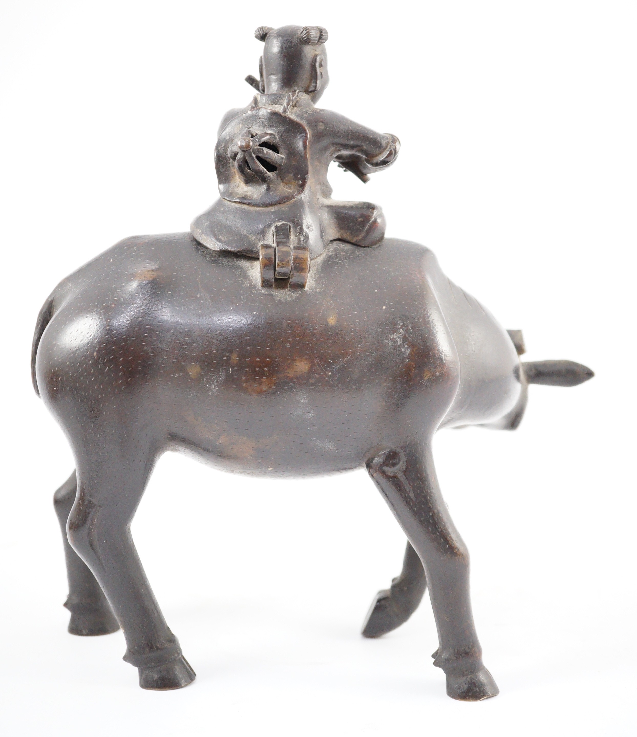 A Chinese bronze ‘boy riding a water buffalo’ censer, 17th/18th century, 22.5cm long, one horn detached but present